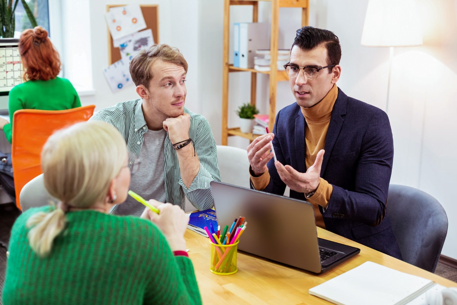 How Important Is Social Media Marketing for Small Businesses 2 serious young man looking his colleague while talking about work