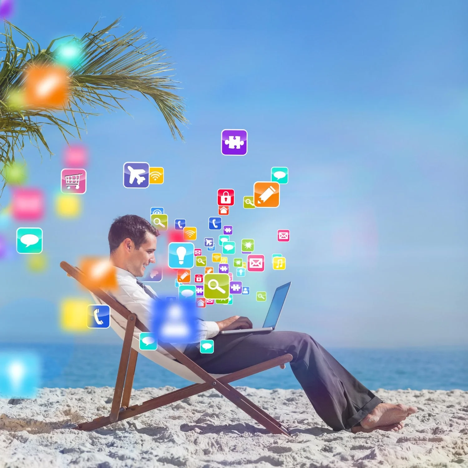 young businessman his beach chair using his laptop with colourful computer applications